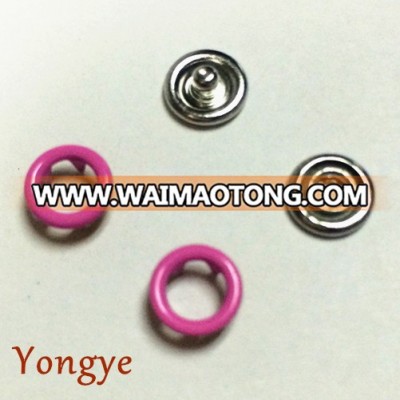 Bright-coloured metal prong ring snap fasteners for baby wear